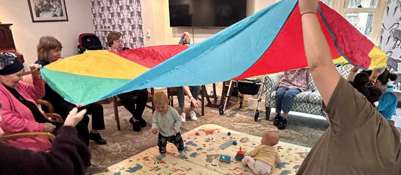 intergenerational-activity-aged-care-children-parachute-game